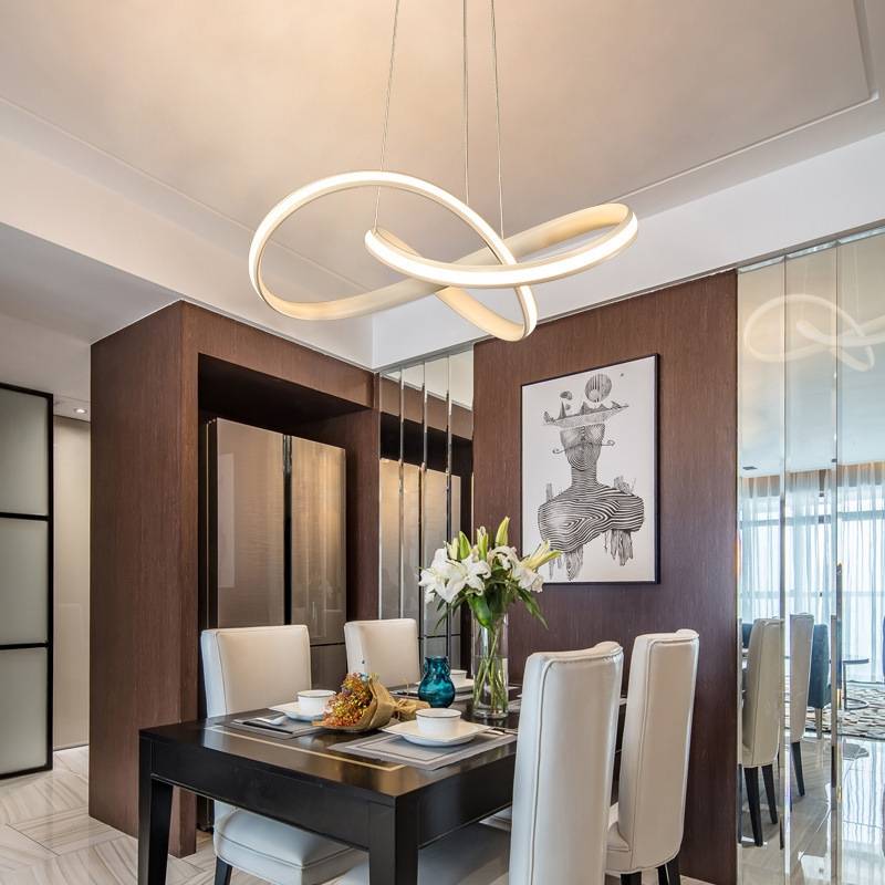 White Louise loop pendant above a dining table.