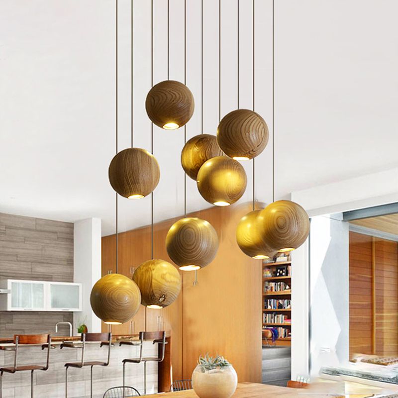 Wooden ball pendant cluster above a kitchen island