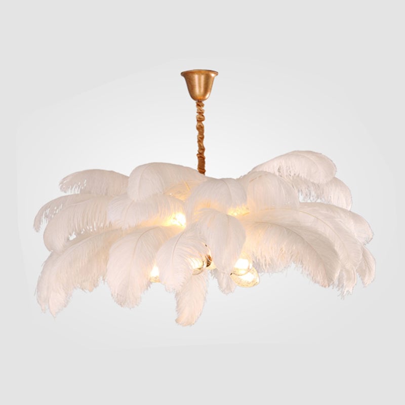 White O'Moore option with layered feathers, lit globes, gold-toned cup canopy and wrapped suspension on pale background