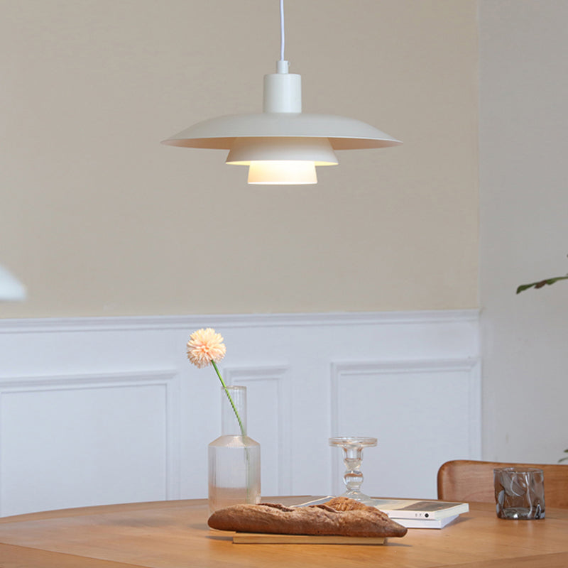 A-White tiered disc pendant over table