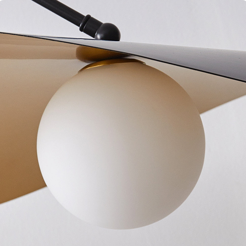Close view beneath layered shade with white globe bulb