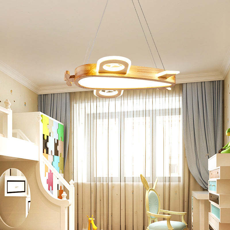 Lower-angle airplane pendant view beside a puzzle-panel bunk bed, window and bunny-ear chair