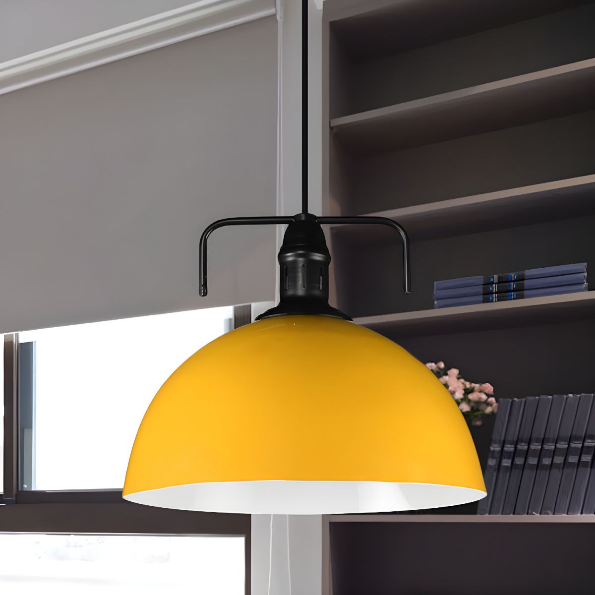 Yellow metal dome pendant near shelves