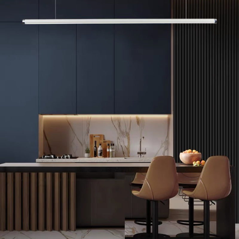 Horizontal tube pendant above a kitchen island with two upholstered stools