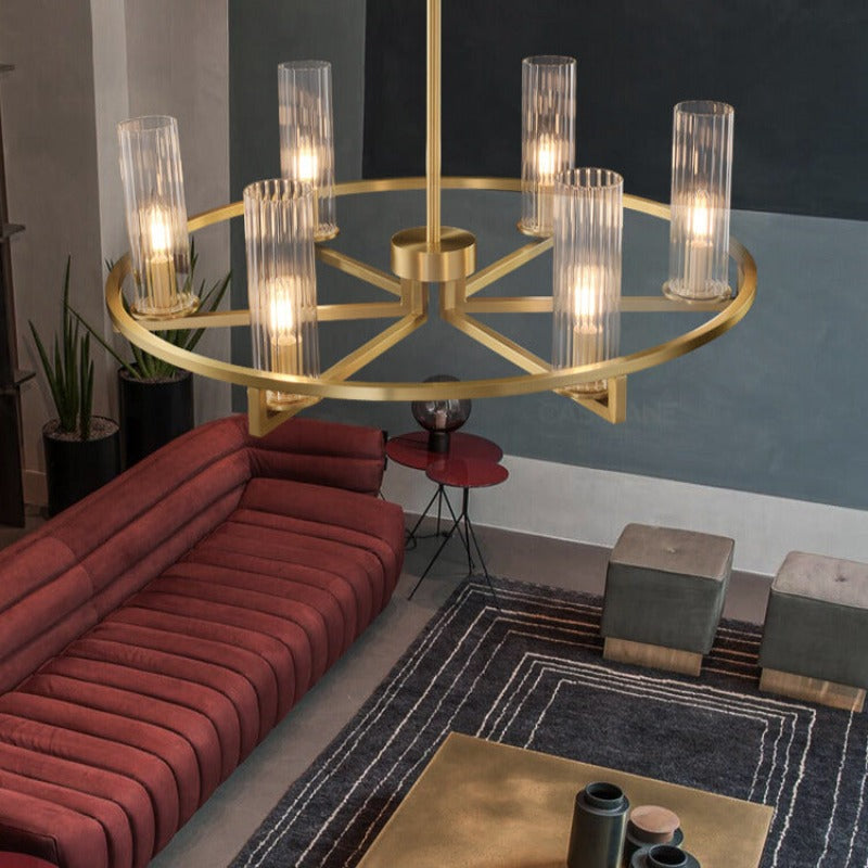 Gold-tone ring pendant over red sofa living area