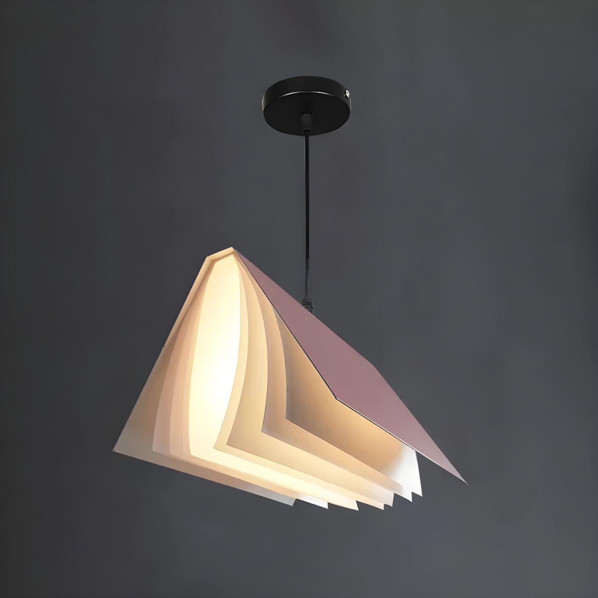 Pink open-book pendant against grey background