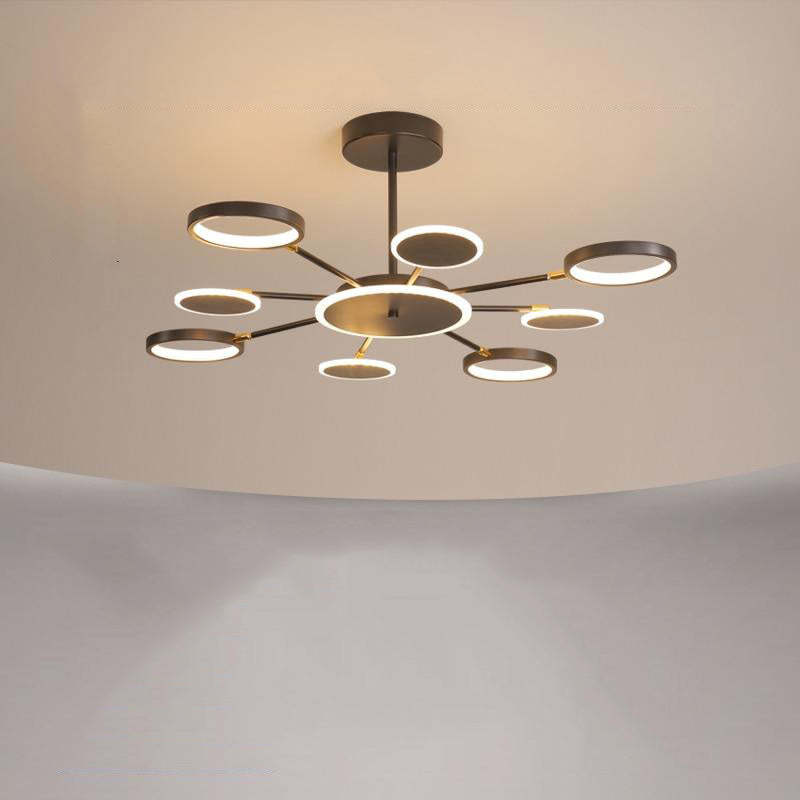 Eight-arm radial ring and disc fixture with flat glowing heads and a rigid ceiling stem