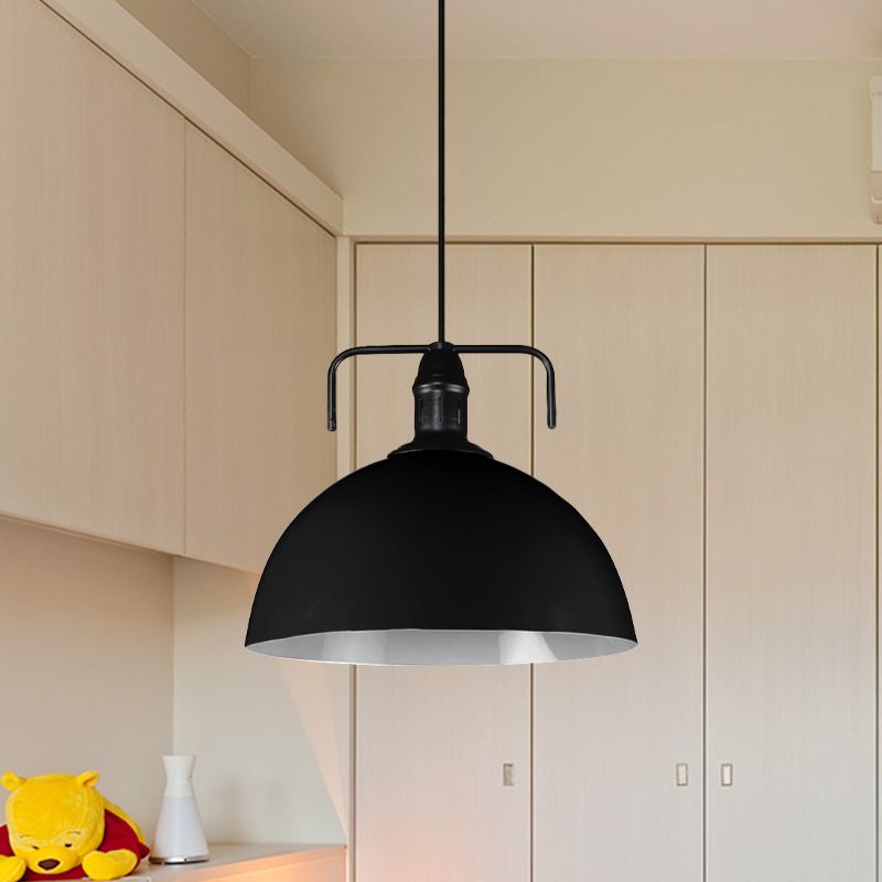 Black metal dome pendant in pale room