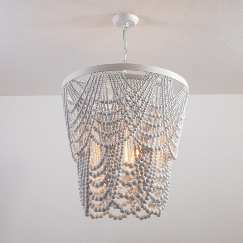 White beaded pendant with light circular frame