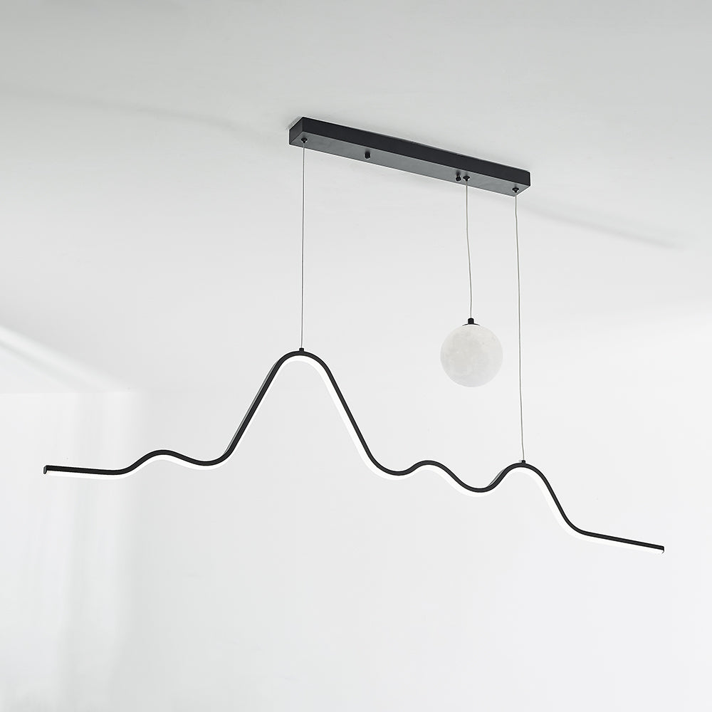 Black wavy light and pale globe under a dark ceiling rail