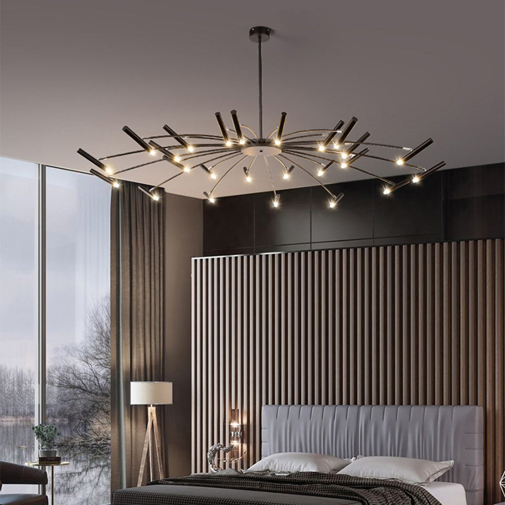Black Evette horizontal-head chandelier lit above a bed beside a dark slatted wall