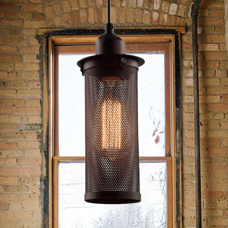 Rust Sanna pendant lit in front of a brick-framed window