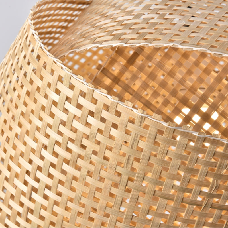 Close-up of the overlapping woven strips and open lattice of a Ritta pendant shade.