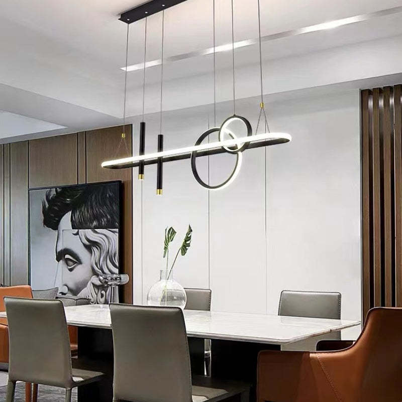 Black Madina remote-dimming option above a dining table near framed art