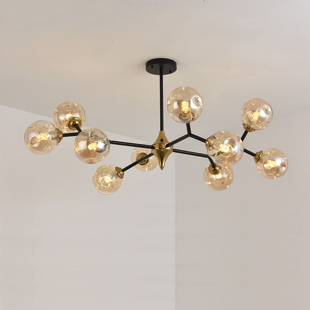 Ten-head amber globe chandelier against a pale wall
