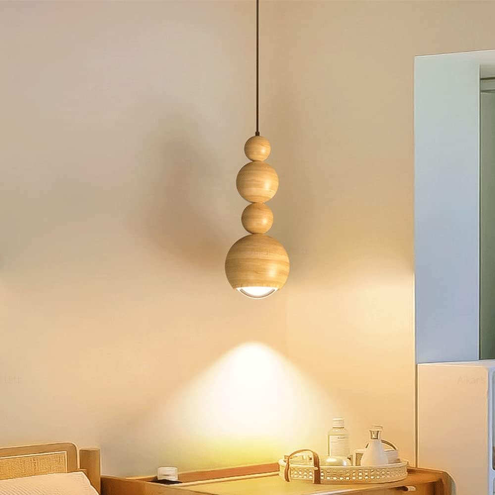Wood-coloured Muto pendant casting light onto a small tabletop.