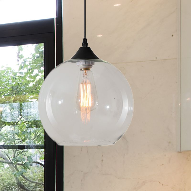Clear glass globe pendant in a furnished room