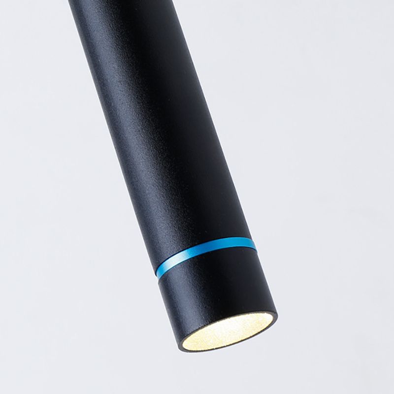 Lit lower opening of a black Edge cylinder with a narrow blue-looking ring