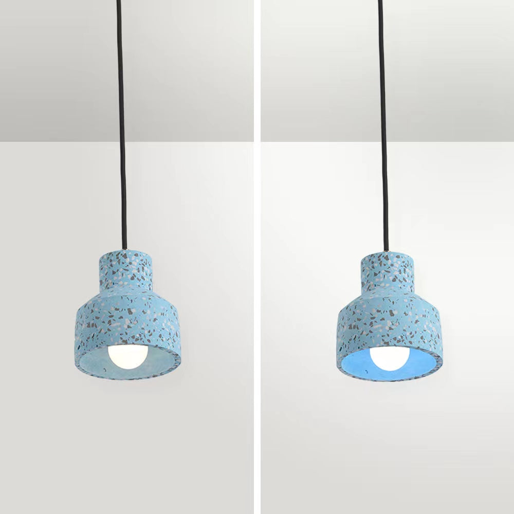 Blue Morandi speckled cement pendant composite with warmer and whiter illumination inside the open bell shade