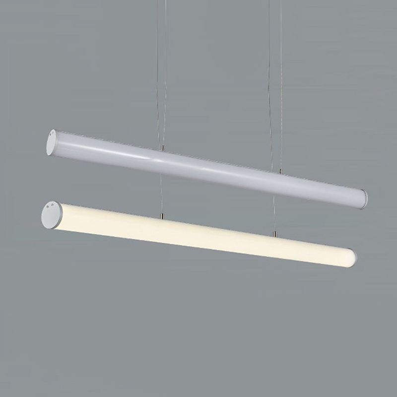 Two tube pendants shown with cool-looking and warm-looking illumination