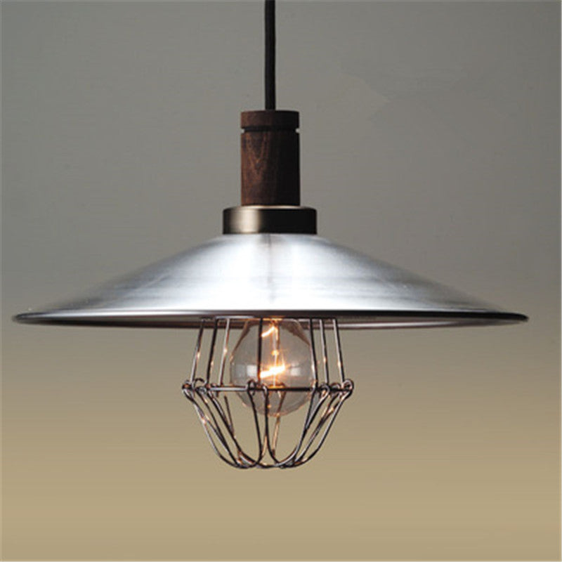 Alessio broad silver metal shade above a visible bulb cage