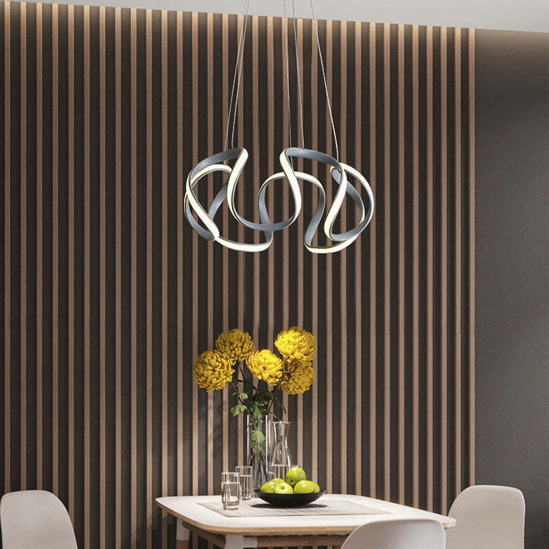 Gray five-head flower-like pendant above dining table
