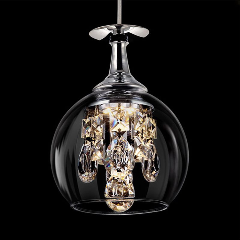 Close-up of the rounded Kristy clear glass shade, reflective upper fitting and faceted hanging drops.