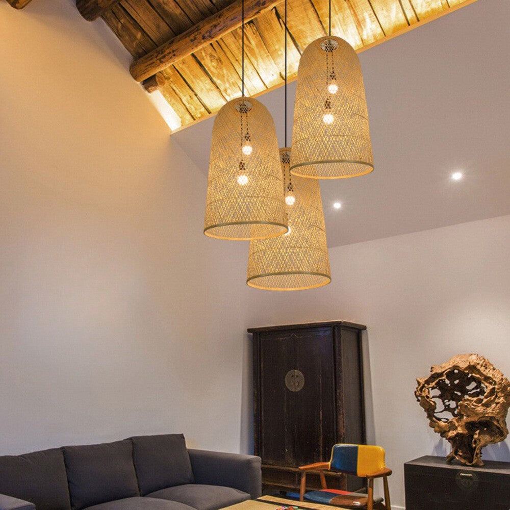 Three Ritta bamboo pendants above a living room seating area