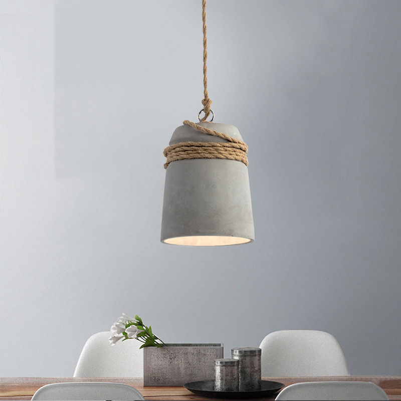 C natural-coloured rope-trim cement pendant over a table