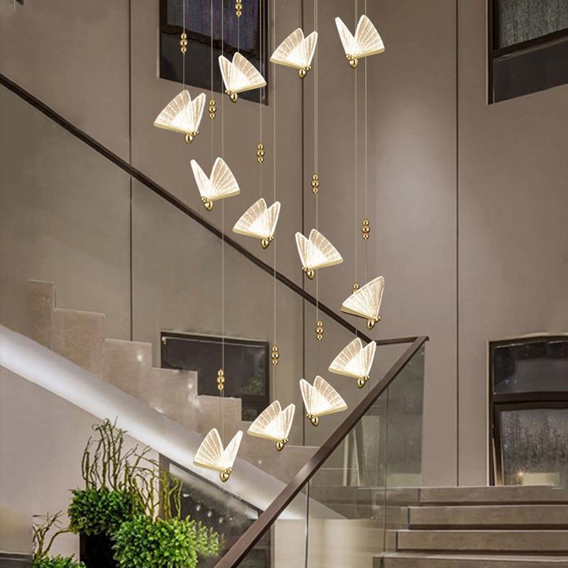 Many Kady butterfly pendants suspended at different heights above stairs