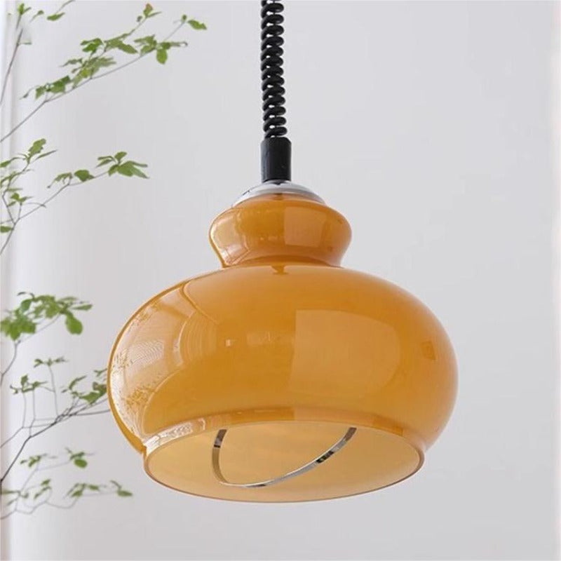 Orange glass dome pendant with dark spiral cord