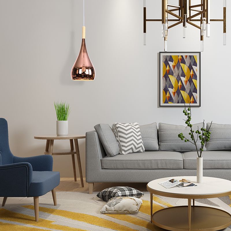 Avi Rose Gold teardrop pendant in a living room