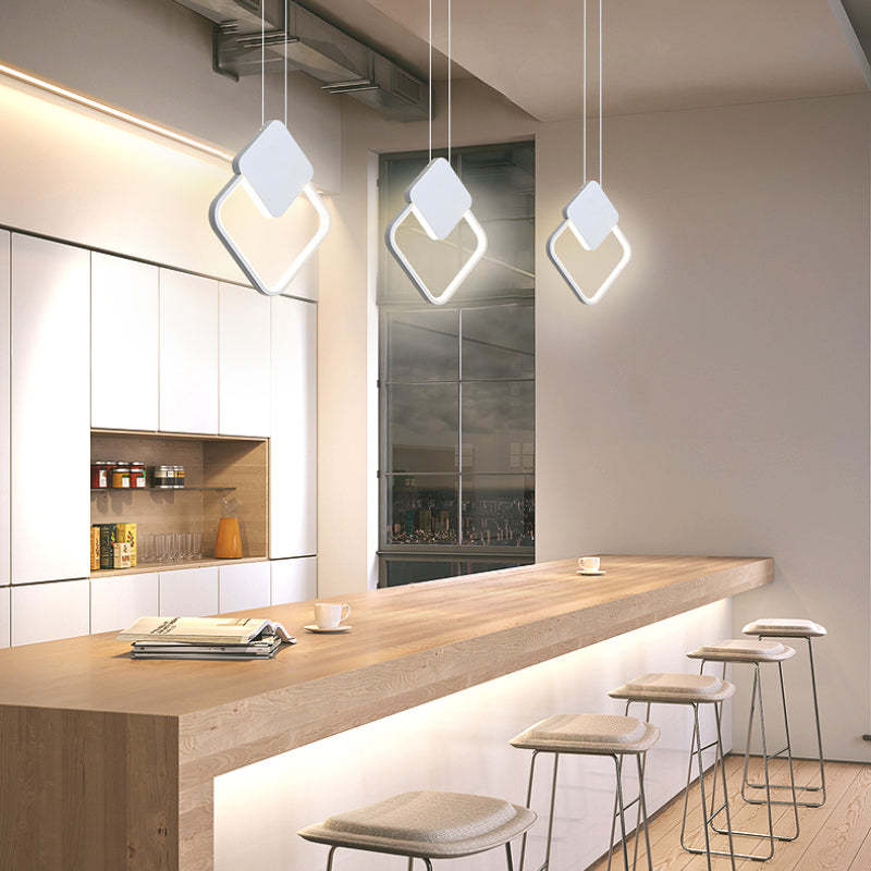 Three white diamond-outline pendants above counter