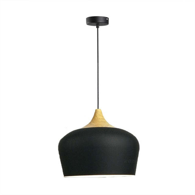 Black Nazifa dome pendant and wood top beneath a round black canopy.