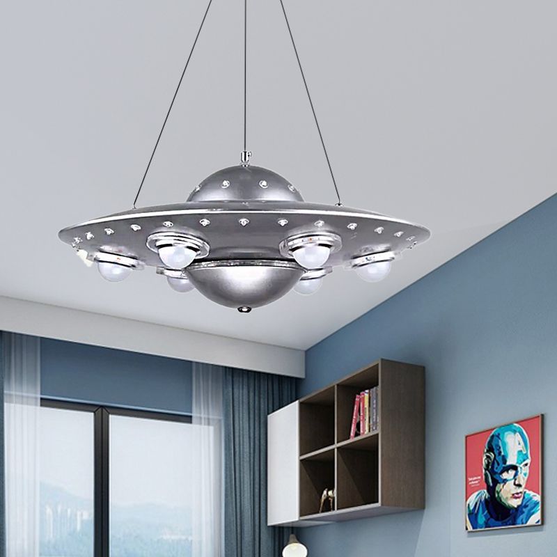 Alessio silver flying-saucer pendant in a blue bedroom