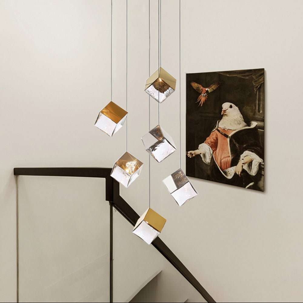 Clear glass and gold cube cluster beside stair rail