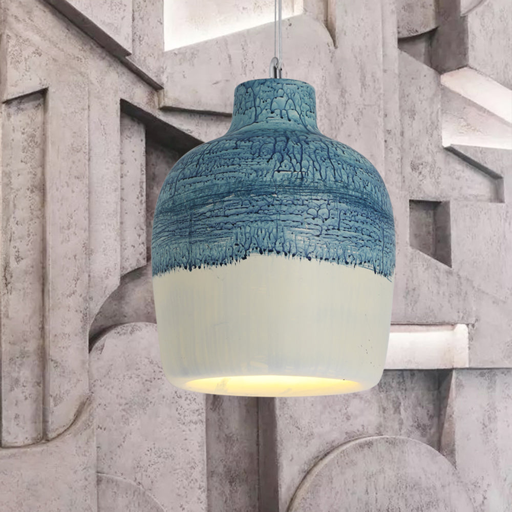Close view of the Byers White + Blue shade against a geometric wall, showing raised blue patterning and a pale lower band.