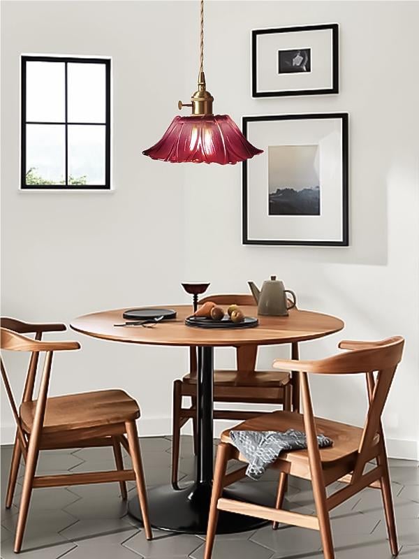 Compact purple lotus glass pendant above a dining table