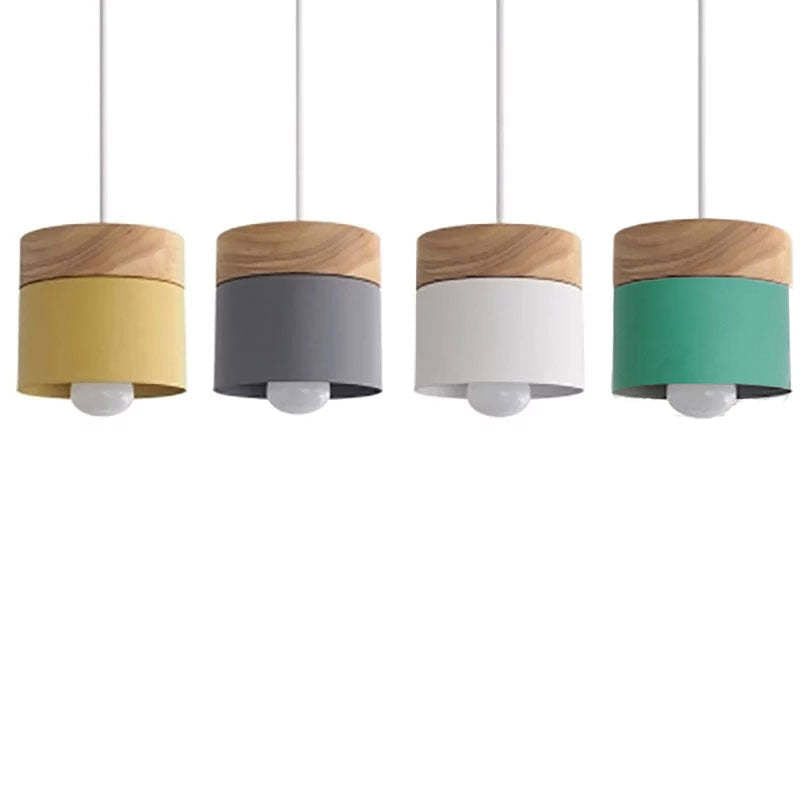 Yellow, gray, white and green cylindrical heads aligned in a color-display photograph