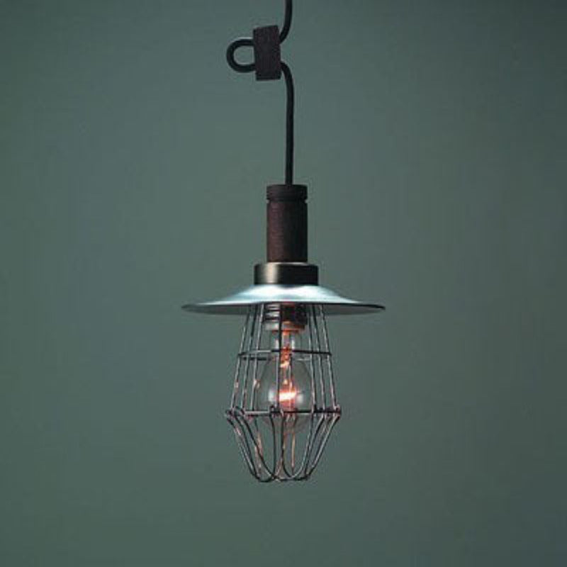 Alessio compact silver-gray pendant and wire cage against a dark green wall