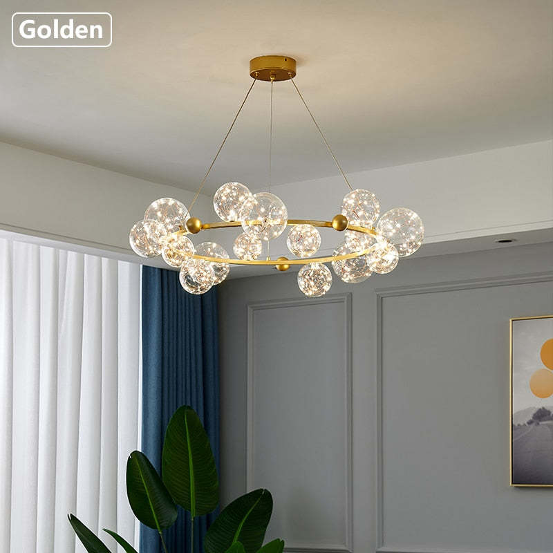 Gold circular LED-wire glass chandelier in bright room