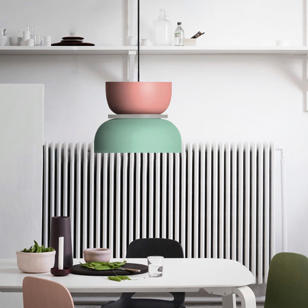 Morandi Pink Green shallow bowl and broad dome pendant above a white dining table beside shelves and a radiator