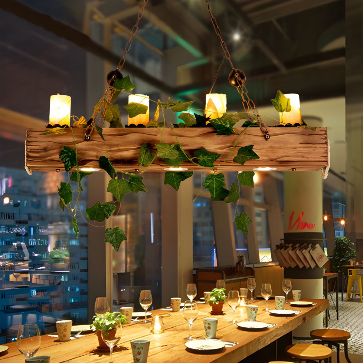 Austin rustic beam pendant with trailing leafy decoration above a dining table.
