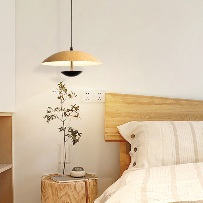 C wood-grain-look dome pendant beside bed