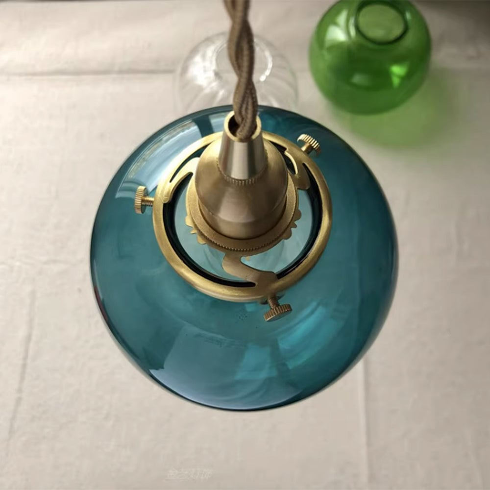 Top view of blue-green glass shade and gold-tone fitting