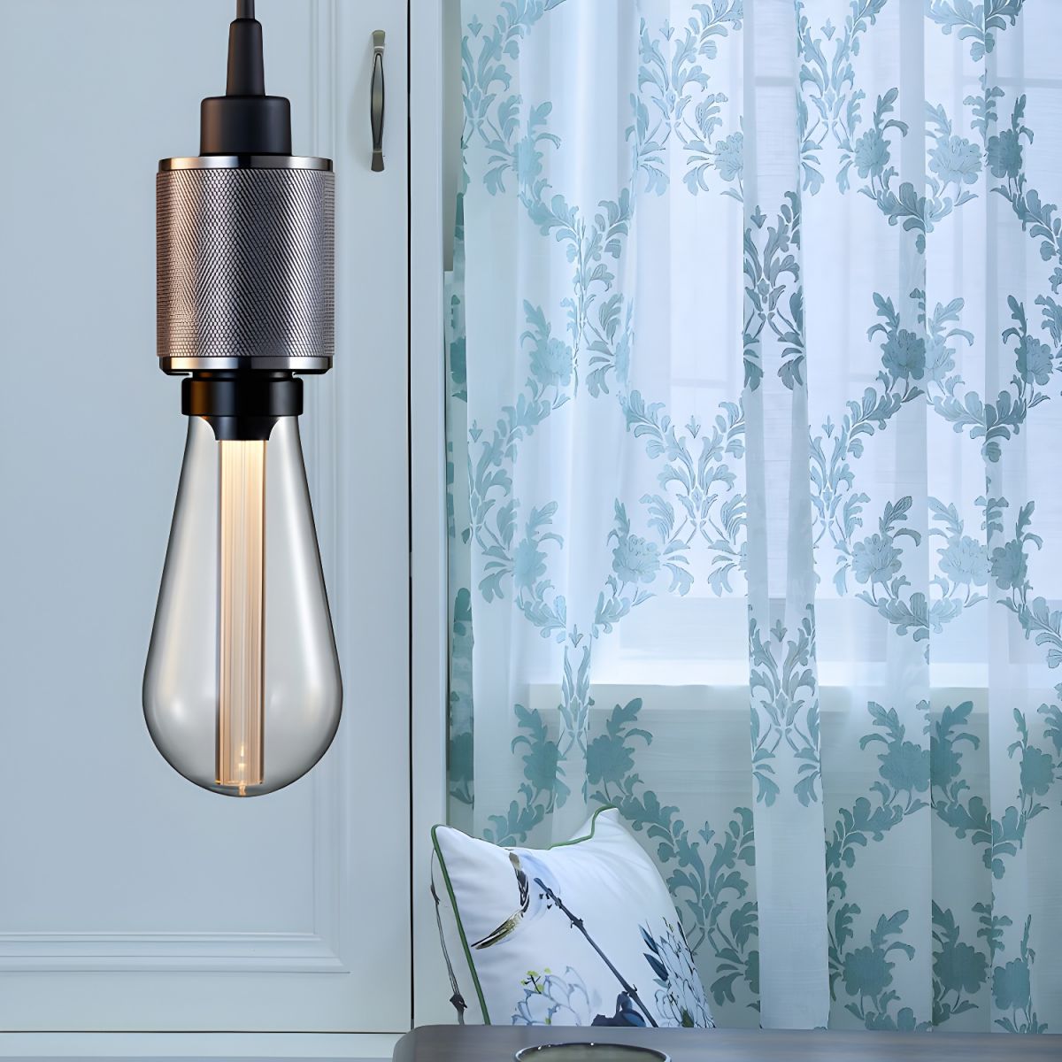 Cooley Silver pendant holder pictured near patterned curtains
