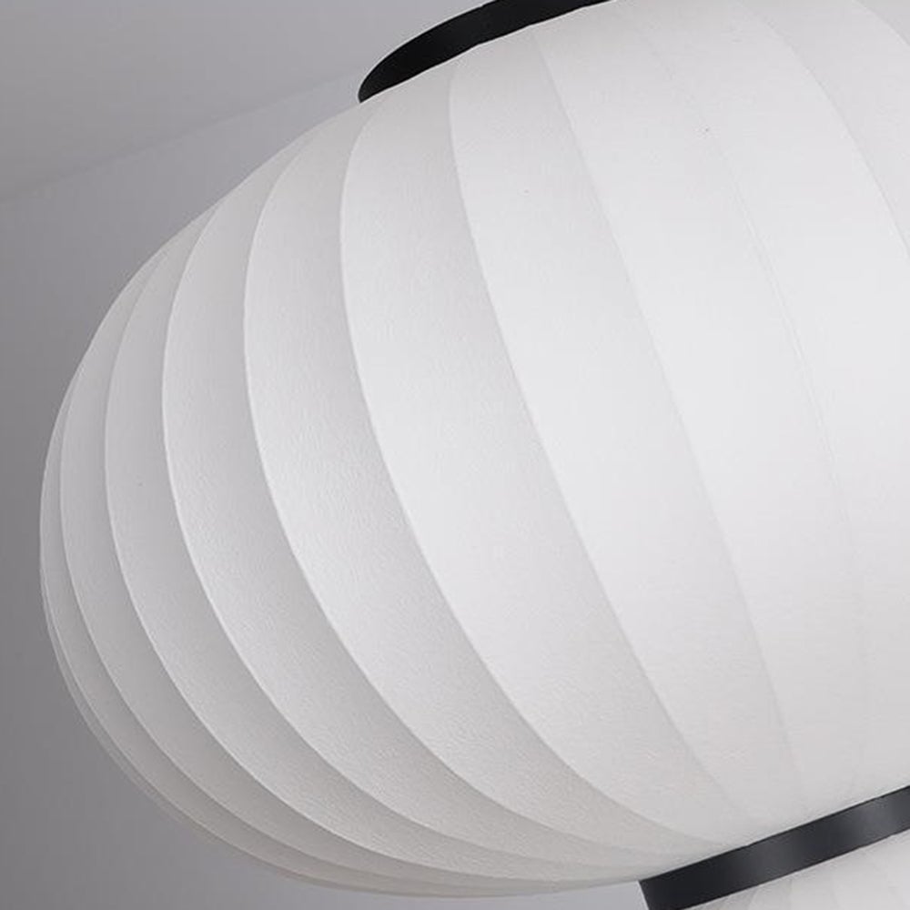 Broad white upper shade with curved panels, black top fitting and lower connecting band