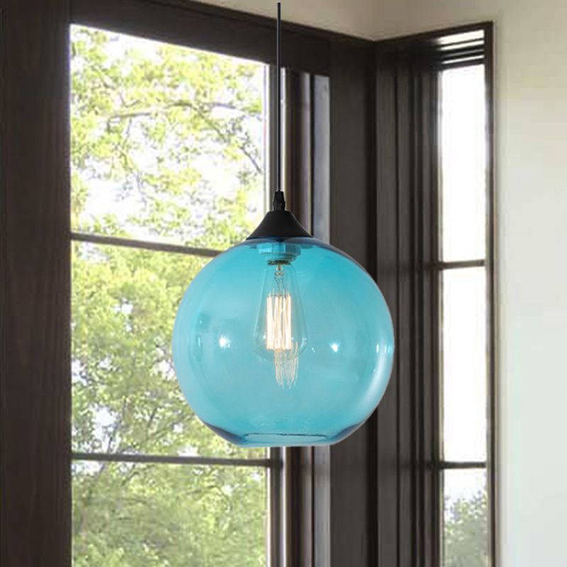 Sky Blue glass globe pendant by a window