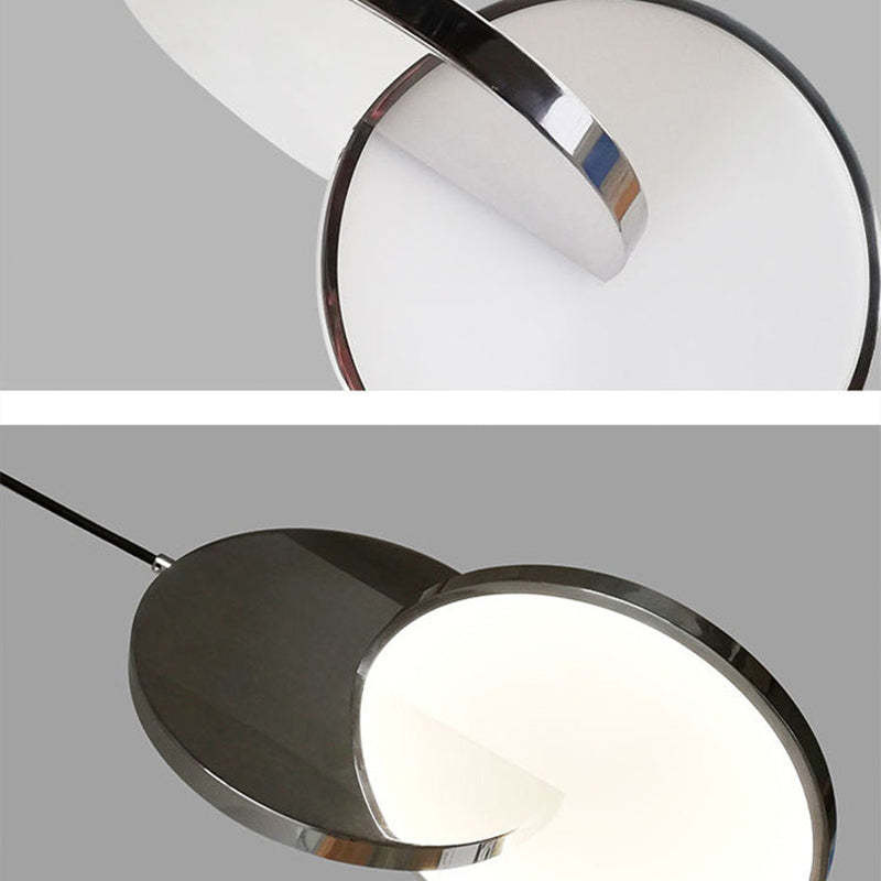 Close views of Welsh intersecting reflective discs and an illuminated circular face.