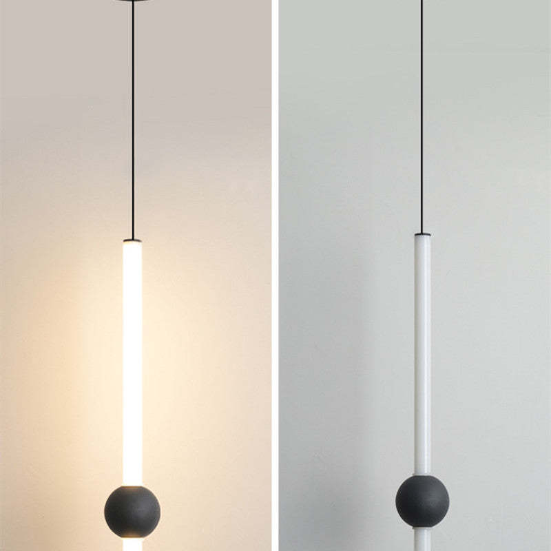 White-rod Carr pendant with black globe shown illuminated and unlit.